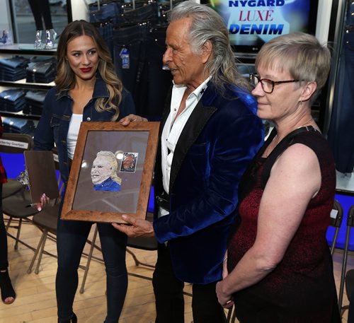JASON HALSTEAD / WINNIPEG FREE PRESS

Shannon Gratton (right) presents Peter Nygard with an embroidered image of him on Sept. 15, 2017 at the Nygard Fashion Show in support of Breast Cancer Research and to preview the companys new fall fashions at the Nygard Fashion Park store on Kenaston Boulevard. All ticket proceeds will be donated to CancerCare Manitoba. (See Social Page)