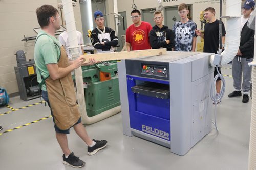 Canstar Community News Sept. 14, 2017 - Michael Bilyk, wood shops teacher, demonstrates how to operate one of the machines at the new wood shops at Garden City Collegiate. (LIGIA BRAIDOTTI/CANSTAR COMMUNITY NEWS/TIMES)