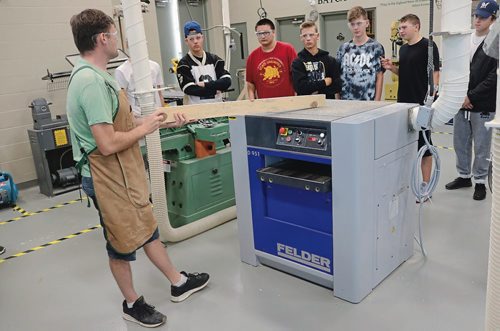 Canstar Community News Sept. 14, 2017 - Michael Bilyk, wood shops teacher, demonstrates how to operate one of the machines at the new wood shops at Garden City Collegiate. (LIGIA BRAIDOTTI/CANSTAR COMMUNITY NEWS/TIMES)