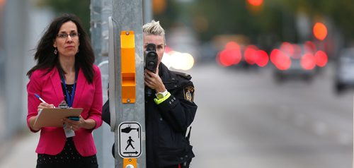 WAYNE GLOWACKI / WINNIPEG FREE PRESS

At left, Nelia Husack, Principal at École Victoria-Albert School records vehicle speeds on William Ave. near her school Tuesday morning with Winnipeg Police Const. Heather Lysak.  This was part of CAA Manitoba's seventh annual school zone safety assessment. Sept. 19 2017
