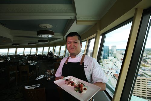 RUTH BONNEVILLE / WINNIPEG FREE PRESS

Restaurant Review: The Revolving Restaurant, Prairie 360 chef  Chef Huan Nguyen  holding his dish Huan Tuna Carpaecio Piquant.


 
SEPT 18, 2017
