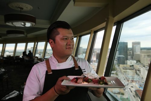 RUTH BONNEVILLE / WINNIPEG FREE PRESS

Restaurant Review: The Revolving Restaurant, Prairie 360 chef  Chef Huan Nguyen  holding his dish Huan Tuna Carpaecio Piquant.


 
SEPT 18, 2017
