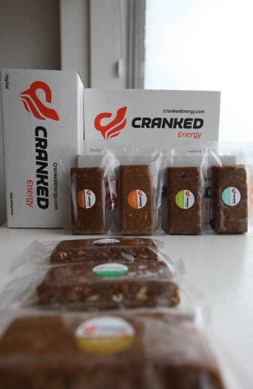 RUTH BONNEVILLE / WINNIPEG FREE PRESS

INTERSECTION - cranked energy
 Cranked Energy, 1853 Portage Ave.  owner Cheryl Zealand.
An Intersection piece on Cranked Energy - the only energy bar-only store I've ever heard of.  Zealand started working on her line of energy bars seven years ago, when, as the mother of newborn twins, she never had time to eat. She bought protein bars but didn't like the taste or texture, so started making her own bars. As soon as friends and family tried them, they told her she go into business. (Her bars differ from what's on the market in that they are fresh-made, and have to be stored in the fridge, as they have a short shelf-life. But because they're so fresh - and tasty - they're a big hit with tons of athletes, including members of the Jets.)

Shots of Cheryl in her store, creating bars, packaging bars - and standing in front of her "flavour wall," which lets visitors know which of her 10 flavours are available on any given day. (People buy these things like donuts - they come in first thing in the morning and choose a dozen bars of various flavours, to take to work meetings)
SEPT 19, 2017
