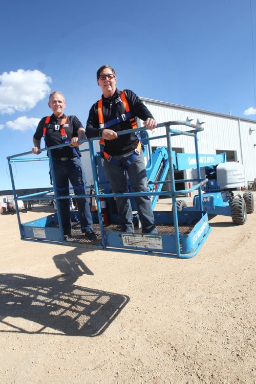 JOE BRYKSA / WINNIPEG FREE PRESSEd Dwyer- President of C&T Rentals, left, with his safety manager Alain Houle on a lift rental- C&T Rentals is  Manitobas largest independently- owned rental company in their new location at 52 South Landing off of McGillivray. Sept 20, 2017 -( See Murrays biz 49.8  story)