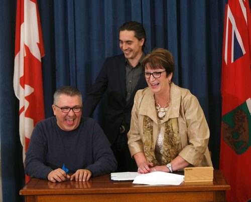 WAYNE GLOWACKI / WINNIPEG FREE PRESS

Chief Tony Powderhorn, Sayisi Dene First Nation, seated, and Eileen Clarke, Indigenous and Northern Relations Minister with Assembly of Manitoba Chiefs Grand Chief Arlen Dumas at the signing ceremony in the Manitoba Legislative building Wednesday. The Manitoba government will be entering into a bilateral provincial Relocation Claim Lands Agreement with the Sayisi Dene First Nation. According to the news release  the bilateral Relocation Claim Lands Agreement will provide 13,054 acres of Crown land at Little Duck Lake to Indigenous and Northern Affairs Canada (INAC) to address the forced relocation of the Sayisi Dene people from their traditional territory.¤ The Crown land will be converted to reserve by INAC and is separate from any treaty land entitlements. Sept. 20 2017
