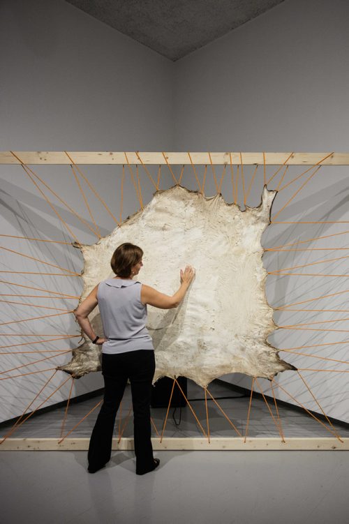 MIKE DEAL / WINNIPEG FREE PRESS
Tammy Sawatzky from the Inuit Art Centre Communications at the WAG tests out an interactive piece by Tsema Igharas, Esghanana (Reclamation) Series, 2016 (moose and abaca paper), one of the works of art by twenty-nine Indigenous artists for the Insurgence/Resurgence show at the Winnipeg Art Gallery.
170921 - Thursday, September 21, 2017.