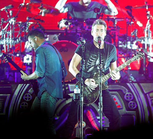 PHIL HOSSACK / WINNIPEG FREE PRESS  -  Nickelback vocalist  Chad Kroeger (right) and guitar player Ryan Peake (left) on stage in Winnipeg Thursday evening. See review? Standup?  - Sept 21 2017