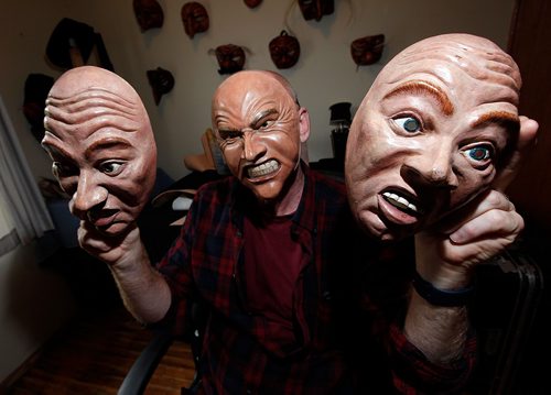 PHIL HOSSACK / WINNIPEG FREE PRESS  -  Chris Sigurdson peers out from behind one of his Commedia dell'arte masks modelled after his own face, he hold two more expressions.  See Wendy's story.  - Sept 23, 2017