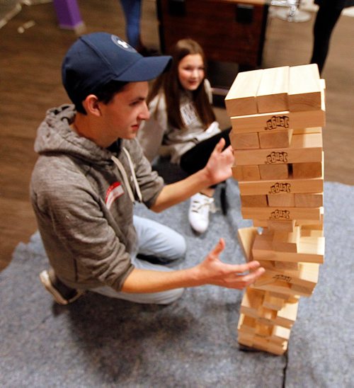 PHIL HOSSACK / WINNIPEG FREE PRESS  -  Terran Malzahn and his sister Sophia react as the tower of their game of 'Jenga" topples Saturday afternoon. The siblings were at the New Big Brother Big Sister facilities grand opening on Ellice ave. Participants and guests dropped in to  532 Ellice ave. as the former transmission shop is now home to offices, meeting areas and drop in facilities for the organization. See release. September 23, 2017