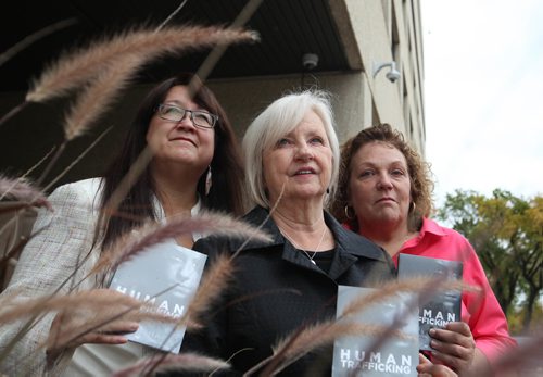 RUTH BONNEVILLE / WINNIPEG FREE PRESS

Joy Smith, founder of the Joy Smith Foundation and former Member of Parliament (centre) along with Diane Redsky.Executive Director of Ma Mawi Wi Chi Itata Centre (left) and Shona Stewart Director of Dignity House (which helps sexually exploited women), stand together for a photo outside the RCMP Headquarters in Winnipeg after the launch of a documentary on Human Trafficking; Canadas Secret Shame produced by the Joy Smith Foundation Monday.
 See Carol Sanders story.  

SEPT 25, 2017