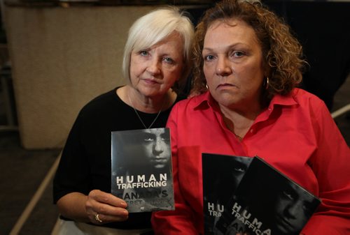 RUTH BONNEVILLE / WINNIPEG FREE PRESS

Joy Smith, founder of the Joy Smith Foundation) and former Member of Parliament (left), along with Shona Stewart Director of Dignity House (which helps sexually exploited women),  hold DVD's of documentary on Human Trafficking; Canadas Secret Shame produced by the Joy Smith Foundation  and  at launch at RCMP Headquarters in Winnipeg   Monday.
 See Carol Sanders story.  

SEPT 25, 2017