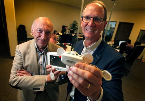 PHIL HOSSACK / WINNIPEG FREE PRESS  -  Earl Gardiner (right)  is CEO of a sleep technology company called Cerebra Health that is innovating a new way to analyze and diagnose sleep disorders that goes way beyond sleep apnea. The company uses technology (the portable testing sensor and monitor held in the photo) developed by noted Manitoba scientist, Magdy Younes (left).  The company just raised significant money to allow it enter the market.  Martin Cash story. - September 25, 2017