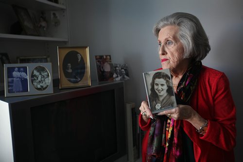 RUTH BONNEVILLE / WINNIPEG FREE PRESS

Portraits of Holocaust survivor Barbara Goszer holding a photo of herself at 15yrs in Poland in her home in Winnpeg.  
Goszer, 87, survived the Holocaust. Talking to her about her experiences then, but also about how she is one of an increasingly fewer living witness to that history.
Also in photo is a portrait of her parent (gold oval frame) and other family photos next to her.  

This is for an end of the year feature project.


See Kevin Rollason's story 
 

SEPT 27, 2017