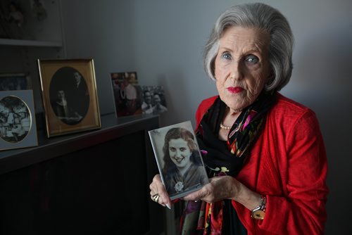 RUTH BONNEVILLE / WINNIPEG FREE PRESS

Portraits of Holocaust survivor Barbara Goszer holding a photo of herself at 15yrs in Poland in her home in Winnpeg.  
Goszer, 87, survived the Holocaust. Talking to her about her experiences then, but also about how she is one of an increasingly fewer living witness to that history.

Also in photo is a portrait of her parent (gold oval frame) and other family photos next to her.  

This is for an end of the year feature project.


See Kevin Rollason's story 
 

SEPT 27, 2017