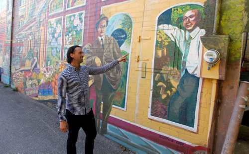 BORIS MINKEVICH / WINNIPEG FREE PRESS
Miller's Super Valu Meats - 590 St Mary's Road - Here Shawn Miller shows the character on the right looks like his grandfather. Mural on the north side of the building.  Dave Sanderson story. Sept. 27, 2017