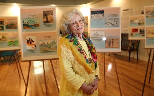 RUTH BONNEVILLE / WINNIPEG FREE PRESS

Genevieve Matkowska, 87yrs,  who as a young Polish girl  survived being a deportee to Siberia than moved to many other countries during the 2nd Worls war, stands next to a new art exhibit that opens Friday at Ogniwo Polish Museum of Polish kids art, some hers, from the gulag in Siberia.  The artwork they drew was depictions of what surrounded them like  barracks, workers and the places they were sent with their families as refugees  Middle East, Iran, Africa, New Zealand and  Mexico. Their story has been buried and forgotten for generations. Nowadays youll see their obits that say they travelled extensively as a child  -- they werent tourists  they were uprooted by Stalin and shunted around the world like many Syrian and African refugees are today.  
 
 Carol Sanders  | Reporter

SEPT 28, 2017