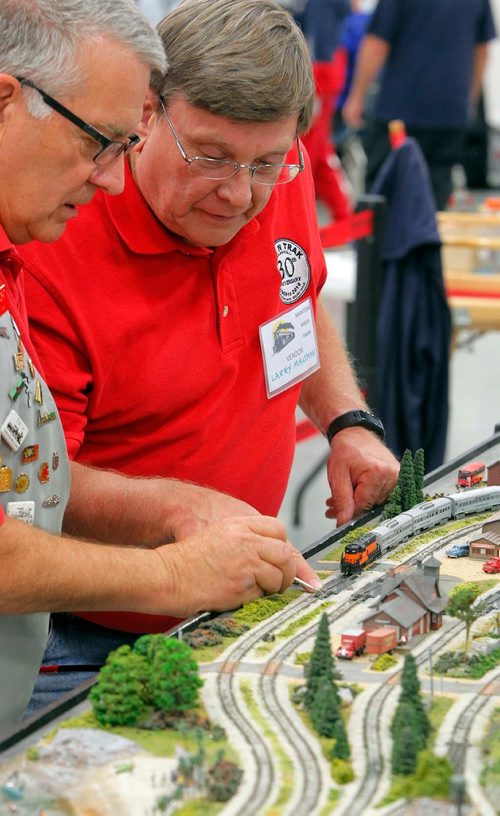 BORIS MINKEVICH / WINNIPEG FREE PRESS
Manitoba Mega Train 2017 - Put on by the Winnipeg Model Railroad Club at Red River Exhibition Park this weekend. It included 17,000 square feet of model trains and 11 layouts designed and set up by hobbyists from across Manitoba and Saskatchewan. WinNtrack club members Ray Kindrat and Larry Maltman do some maintenance to their club display.  Sept. 30, 2017