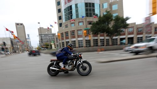 TREVOR HAGAN / WINNIPEG FREE PRESS
Jason Ward riding his motorcycle through Portage and Main during the Gentlemans Ride, a charity motorcycle ride raising money to fight prostate cancer, Sunday, October 1, 2017.