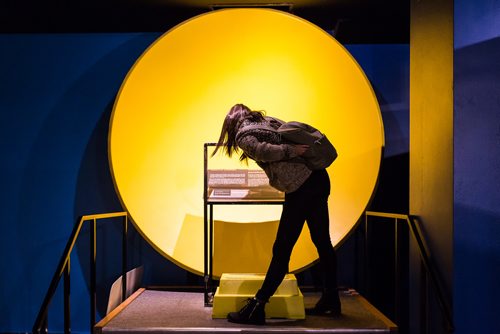 A woman tests out the sound dish at The Manitoba Museum's Touch the Universe exhibit during Nuit Blanche. September 30, 2017 (GREG GALLINGER / WINNIPEG FREE PRESS)