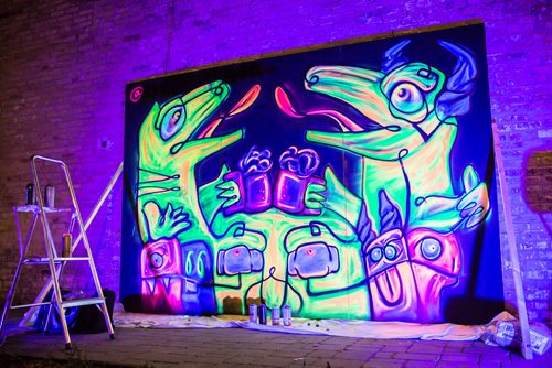 A black light grafitti paiting by Pink Panda in front of PEG Beer Co. during Nuit Blanche. September 30, 2017 (GREG GALLINGER / WINNIPEG FREE PRESS)