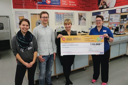 Canstar Community News Sept. 26, 2017 - NorWest Co-Op Community Health Youth Hub counsellor Kaelee Vandenbougerd, Youth Hub programmer Mark Aitken, NorWest Co-op Community Health project manager Laura Horodecki and Keewatin Street Canada Post office manager Jenilee Mudrik at the Canada Post Community Foundation cheque presentation. (LIGIA BRAIDOTTI/CANSTAR COMMUNITY NEWS/TIMES)