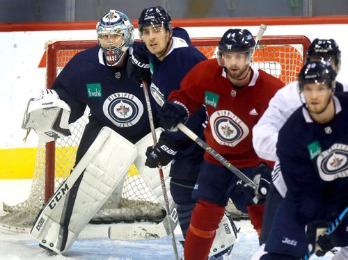 WAYNE GLOWACKI / WINNIPEG FREE PRESS

At left, goaltender Steve Mason watches puck with lot of distraction in front of him at Winnipeg Jets practice at the Bell MTS Place Tuesday. Jason Bell story¤ Oct.3 2017