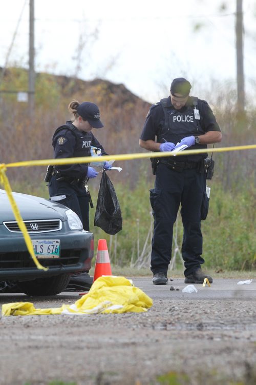 RUTH BONNEVILLE / WINNIPEG FREE PRESS

RCMP Investigators retrieve evidence from the scene of a homicide investigation of a 19-year-old victim (girl) on provincial why 502 in Lac du Bonnet Tuesday.   The girl was found dead from knife wounds in her vehicle that was found on the side of the Hwy  by area residents at about 6:30am Tuesday.  



Oct 03, 2017