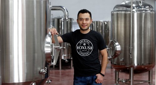 WAYNE GLOWACKI / WINNIPEG FREE PRESS

Sean Shoyoqubov, owner of Oxus Brewing Co. on Sanford St. in Winnipeg. He is by his beer brewing equipment soon to be in use. Ben MacFee-Sigurdson story¤ Oct.4 2017