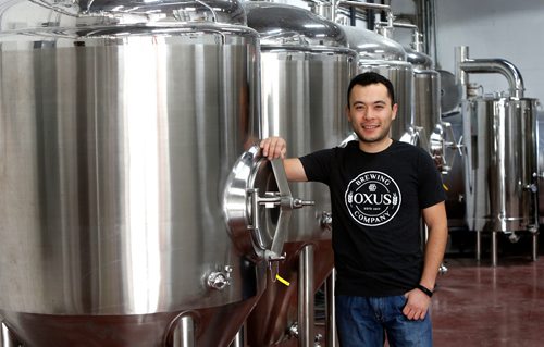 WAYNE GLOWACKI / WINNIPEG FREE PRESS

Sean Shoyoqubov, owner of Oxus Brewing Co. on Sanford St. in Winnipeg. He is by his conical beer fermenters soon to be in use. Ben MacFee-Sigurdson story¤ Oct.4 2017