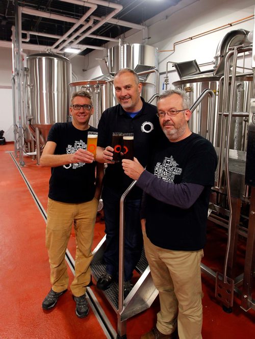 BORIS MINKEVICH / WINNIPEG FREE PRESS
Feature on new breweries. Stone Angel Brewing Co. at 1875 Pembina Hwy. From left, Corporate Secretay/Director of Finance James DeFehr, President/Director of Operations Paul McMullan, and Vice President/Director of Marketing Paul Clerkin pose for a photo in the brewery part of the business. Ben MacPhee-Sigurdson story. Oct 4, 2017