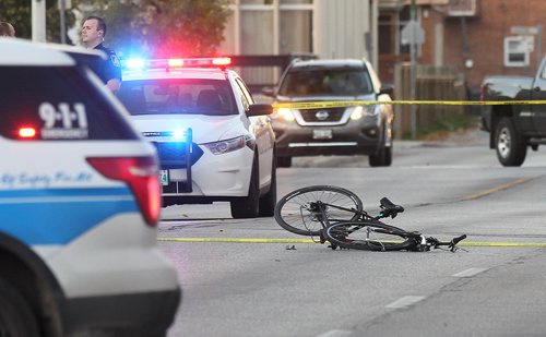 RUTH BONNEVILLE / WINNIPEG FREE PRESS

Winnipeg Police and Cadet units block off Arlington street from Stella Ave. to Selkirk Ave. to investigate a cyclist that was hit by a car later Wednesday afternoon.  

Oct 04, 2017