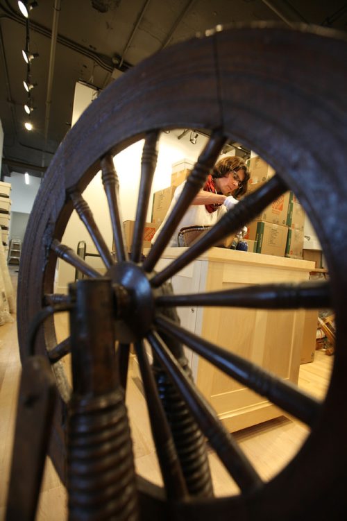 RUTH BONNEVILLE / WINNIPEG FREE PRESS

49.8 feature: Manitoba Craft Council and the Manitoba Craft Museum and Library.
Photo of the curator of the MB craft museum and library, Andrea Reichert,as she  opens up boxes  in new space Wednesday.  
Feature story on the newly relocated C2 Centre for Craft thats opening up its doors with the Manitoba Craft Council and the Manitoba Craft Museum and Library at 329 Cumberland Ave.  

The story is about how this new space is filling in the craft scene and about the craft vs. art debate and why they need their own space in the first place.

Photos of:
 them unpacking and moving into the new space at 1-329 Cumberland ave., MB craft museum curator (Andrea Reichert), photos of MB Craft Council Director (Tammy Sutherland), Museum Gallery items in showcase, items being unpacked for 1st show (show is titled "best"), craft book library and locally made craft pieces like, colander bowl and beautifully handcrafted, usable, teapots that will be for sale in their onsite store.  

The curator of the MB craft museum and library, Andrea Reichert, is the contact for story. 
See Erin Lebar story.
Oct 04, 2017