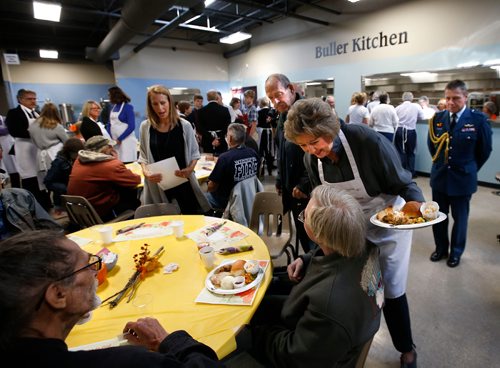 WAYNE GLOWACKI / WINNIPEG FREE PRESS

Lt. Gov. Janice Filmon serves a guest at  Siloam Mission's traditional Thanksgiving feast at the grand opening of their new kitchen, dining room and drop-in centre at 303 Stanley St. Friday.  Volunteers expect to serve 1,000 meals in this Siloam Mission facility right behind their Princess St. location. The brand new dining room seats more than 400 people, this opening completes phase one of a two-part development plan.  Oct.6 2017