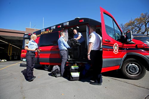 RUTH BONNEVILLE / WINNIPEG FREE PRESS

 Deputy Chief  &#8206;Winnipeg Fire Paramedic Service Tom Wallace, (white shirt), with other WFPS employees look over the new Fire Trucks that were unveiled to the media at the The Ellen Street - Firehall No.1 Friday.  
Various photos both outside and inside the new, compact vehicles.  

Oct 05, 2017