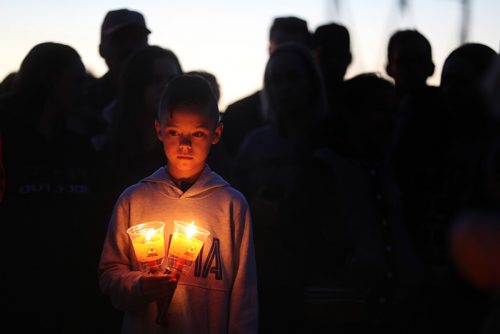 TREVOR HAGAN / WINNIPEG FREE PRESS
A young boy holds candles at a vigil for Brittany Bung in Lac du Bonnet, Friday, October 6, 2017.