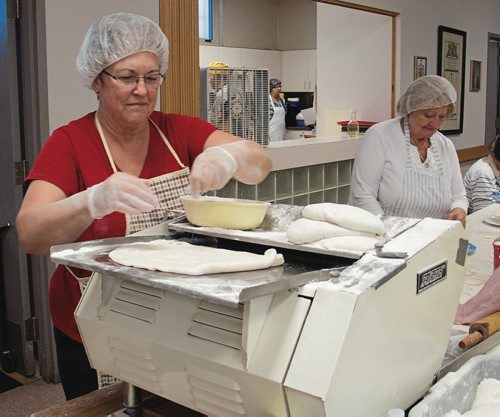 Canstar Community News Rosalie Shupenia, seen here rolling perogy dough, has been volunteering at Holy Eucharist Church for the past three years. (SHELDON BIRNIE/CANSTAR/THE HERALD)