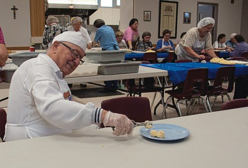 Canstar Community News Morris has been volunteering at Holy Eucharist for 17 years. Every Wednesday he arrives at 5:30 a.m. to start making perogy dough, then moves onto balling the potato and cheese filling. (SHELDON BIRNIE/CANSTAR/THE HERALD)