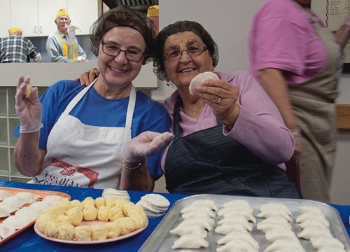 Canstar Community News Emily Hawrysh (left) and Jean Rotinsky pinch perogies every week at Holy Eucharist Church. (SHELDON BIRNIE/CANSTAR/THE HERALD)