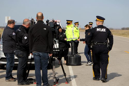 RUTH BONNEVILLE / WINNIPEG FREE PRESS

RCMP set up simulation event for the media on Rosser Road on Thursday  to address the issue of safely when motorists are passing officers.   A mannequin dressed as a RCMP officer stood next to a vehicle pulled over on a highway illustrating what motorist should and should not do when passing.  Motorist must slow down and change lanes when passing to avoid injury or death to officers.  

 Inspector Ed Moreland, Officer in Charge of Traffic Services, spoke about the risk to emergency personnel when motorists do not take the proper precautions when passing emergency vehicles on the side of the road.


See media release for details.  

Standup 
Oct 12,, 2017