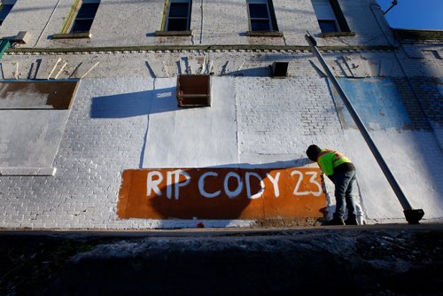 WAYNE GLOWACKI / WINNIPEG FREE PRESS

Jasmine Kabestra-Savage writes a message on the side of the Sutherland Hotel Friday morning in memory of her friend Cody Severight. Cody Severight, 23, was killed at about 8 p.m. Tuesday while crossing Main Street in front of the Sutherland Hotel.  Oct.13 2017