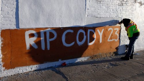 WAYNE GLOWACKI / WINNIPEG FREE PRESS

Jasmine Kabestra-Savage writes a message on the side of the Sutherland Hotel Friday morning in memory of her friend Cody Severight. Cody Severight, 23, was killed at about 8 p.m. Tuesday while crossing Main Street in front of the Sutherland Hotel.  Oct.13 2017