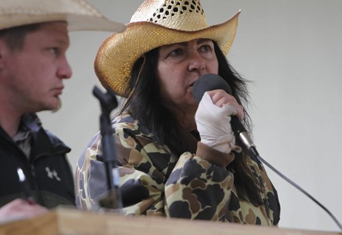 RUTH BONNEVILLE / WINNIPEG FREE PRESS

Photo of Fort Frances farmer, Rhonda Snow, describing each of her rare ponies to potential buyers next to auctioneer at Grunthal Livestock Auction Mart on Saturday with a standing-room only crowd. 

   Story is  about Rhonda Snow, a farmer from Fort Frances who has about 50 small horses that are an endangered breed known as Ojibway ponies.  She took half of  them to the Grunthal Livestock Auction Mart on Saturday to sell the horses and ponies to cover her financial responsiblities as part of a divorce settlement.   

The Ojibway ponies, which once roamed the wilds from Fort Frances to Minnesota, are now rare because of technological changes in agriculture that left them less relevant.  There are said to be  fewer than 50 breeding Ojibway ponies alive in the world.
 
See Bill Redekop story.  
Oct 14,, 2017