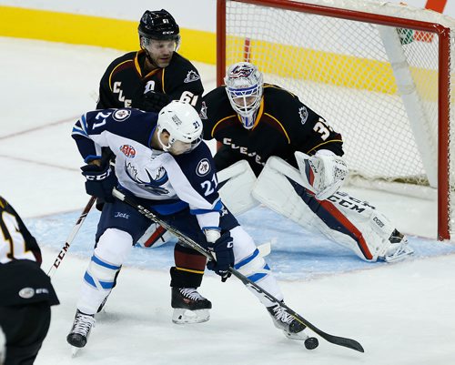 JOHN WOODS / WINNIPEG FREE PRESS
Manitoba Moose Francis Beauvillier (21) attempts the deflection past Cleveland Monsters' Andre Benoit (61) and goaltender Matiss Kivlenieks  (35) during second period AHL action in Winnipeg on Sunday, October 15, 2017.