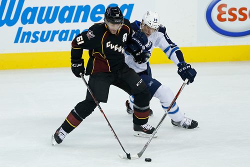 JOHN WOODS / WINNIPEG FREE PRESS
Manitoba Moose Buddy Robinson (10) steals the puck from Cleveland Monsters Andre Benoit (61) during second period AHL action in Winnipeg on Sunday, October 15, 2017.