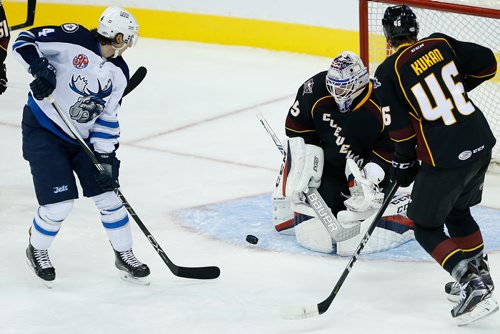 JOHN WOODS / WINNIPEG FREE PRESS
Manitoba Moose Mike Sgarbossa (4) attempts the deflection past Cleveland Monsters' Dean Kukan (46) and goaltender Matiss Kivlenieks  (35) during second period AHL action in Winnipeg on Sunday, October 15, 2017.