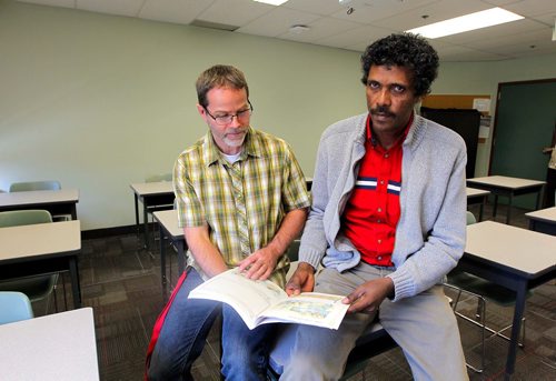 BORIS MINKEVICH / WINNIPEG FREE PRESS
Alazar Elyas, right,an Eritrean refugee who worked in the plumbing trade for 23 years before coming to Canada in June 2016. Here he sits with teacher Floyd Yewchan, left. Elyas is a student at RRCs Language Training Centres Pathway Program to Construction Skills. Photo taken at RRC classroom on the 4th floor at Union Station on Main Street. CAROL SANDERS STORY.  OCT. 17, 2017