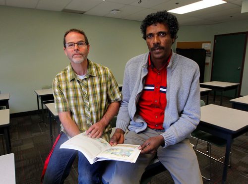 BORIS MINKEVICH / WINNIPEG FREE PRESS
Alazar Elyas, right,an Eritrean refugee who worked in the plumbing trade for 23 years before coming to Canada in June 2016. Here he sits with teacher Floyd Yewchan, left. Elyas is a student at RRCs Language Training Centres Pathway Program to Construction Skills. Photo taken at RRC classroom on the 4th floor at Union Station on Main Street. CAROL SANDERS STORY.  OCT. 17, 2017