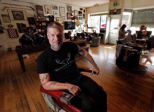 PHIL HOSSACK / WINNIPEG FREE PRESS  - Jeremy Regan poses in his Broadway ave Barbershop Tuesday. Jeremy and his shop are celebrating 5 years with a fundraising celbration. The shop has raised over $75,000 already by donating $1/cut to charity. See Martin Cash story. - October 17, 2017
