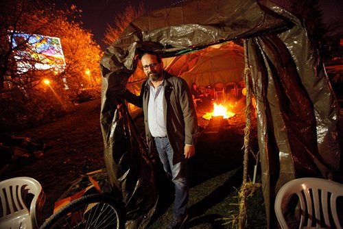 PHIL HOSSACK / WINNIPEG FREE PRESS  -   Murdered and Missing Aborigional Commisionrian Eyolfson poses at the doorway to the ceremonial fire at the Forks where he comes in the evening to meditate and reflect. See Melissa Martin story.  - Oct 17, 2017