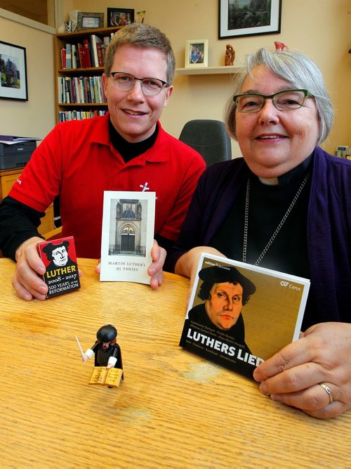 BORIS MINKEVICH / WINNIPEG FREE PRESS
(L-R) Rev. Tyler Gingrich, Assistant to the Bishop Youth and Young Adult Ministry, and Rev. Elaine Sauer, Bishop, pose for a photo with some of the special things brought out for 500th anniversary of Protestant Reformation. Photo taken at Anglican Lutheran house, 935 Nesbitt Bay. OCT. 19, 2017